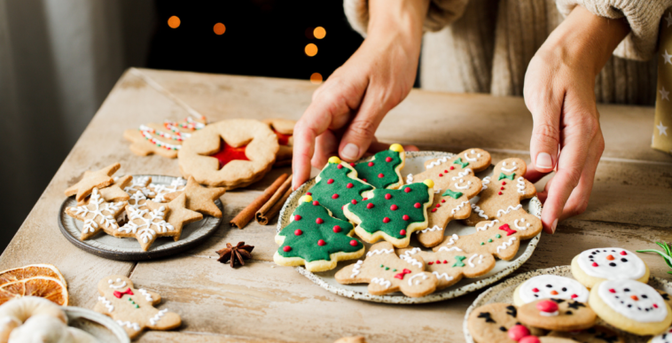 A plate of Christmas cookies on a table.