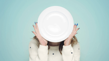 Woman holding an empty plate