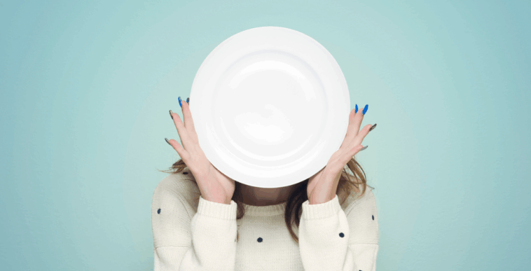 Woman holding an empty plate