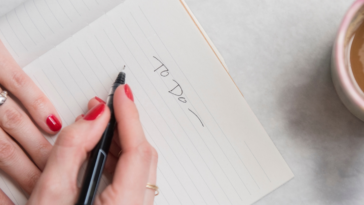 woman writing to do list