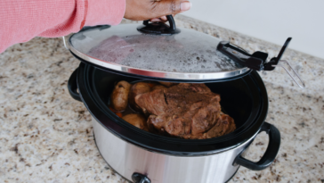 Meat cooking in a crock pot.