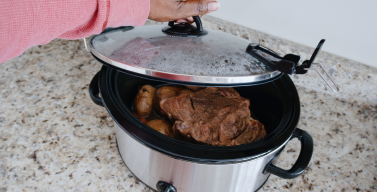 Meat cooking in a crock pot.