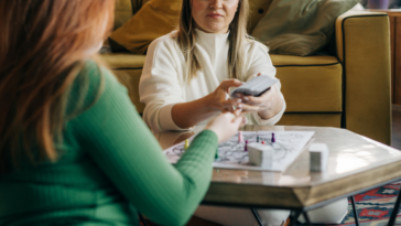 two women playing a board game