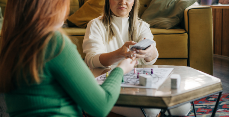 two women playing a board game