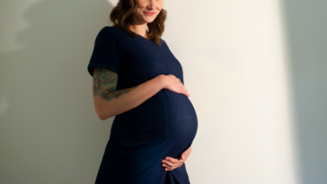 pregnant woman with hands on her belly