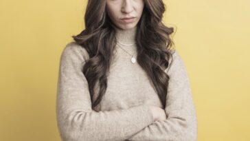 young woman with crossed arms