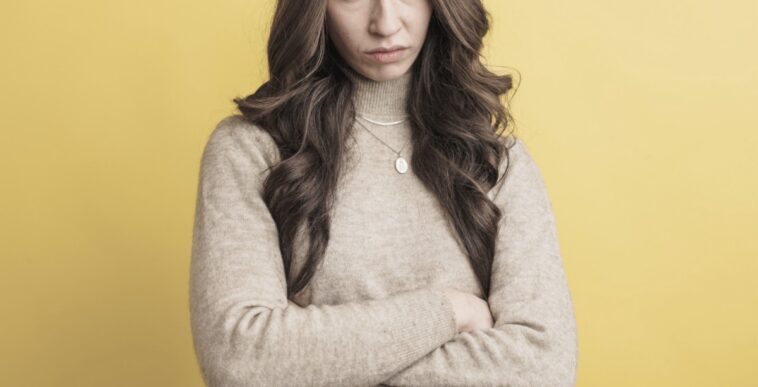 young woman with crossed arms