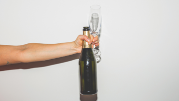 Person offering champagne