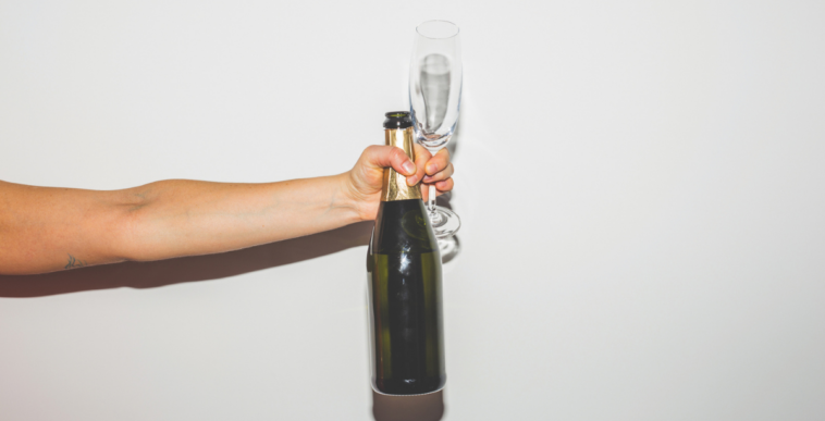 Person offering champagne