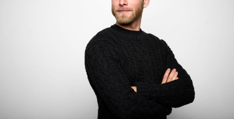 Portrait of a Young Man looking away against White Background.