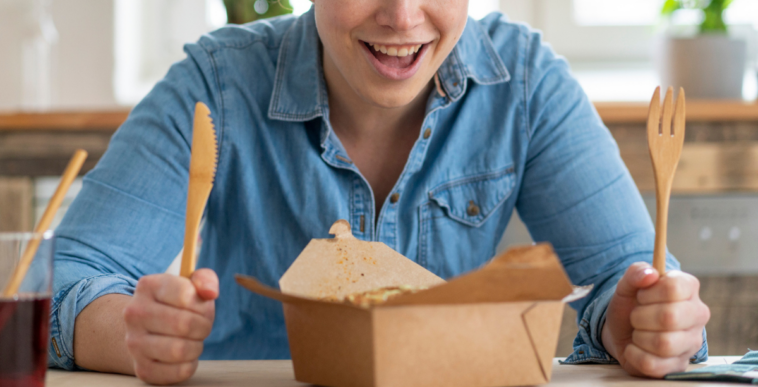 Woman with a takeout food box