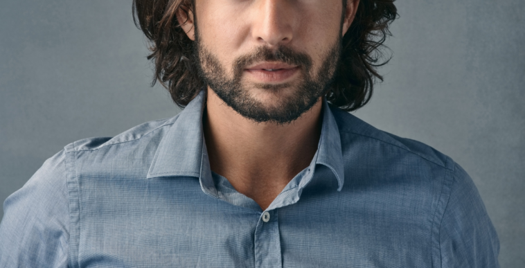 man with hair just above his shoulders