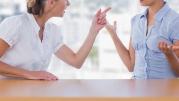 older woman berating younger woman