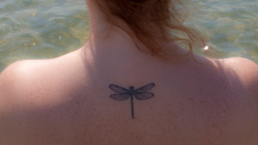 woman with dragonfly tattoo