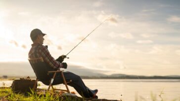 Man on a fishing trip by the lake.