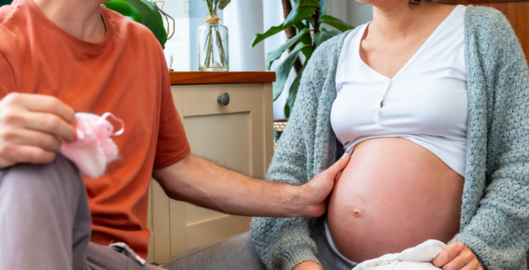 Couple discussing pregnancy
