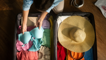 Woman packing suitcase