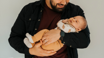man holding infant son
