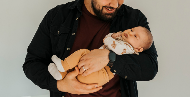 man holding infant son
