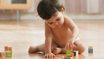 baby playing with blocks