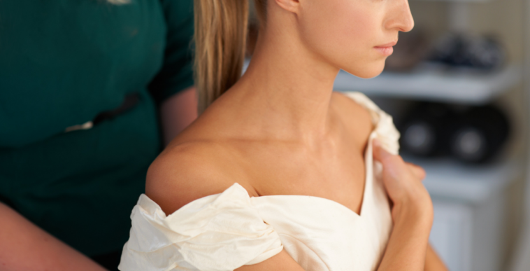 maid of honor helps a bride get ready