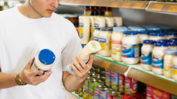 man shopping for mayonnaise