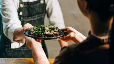 customer is served food in restaurant