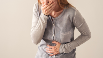 Ill woman holding her stomach