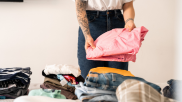 woman sorting through clothes